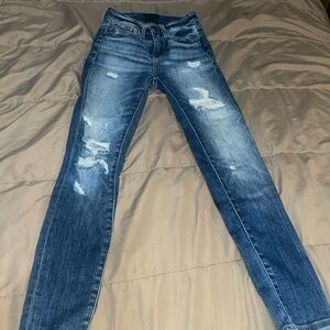 Buckle black skinny jeans